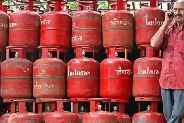 India LPG shortage with stacked domestic gas cylinders and supply pressure
